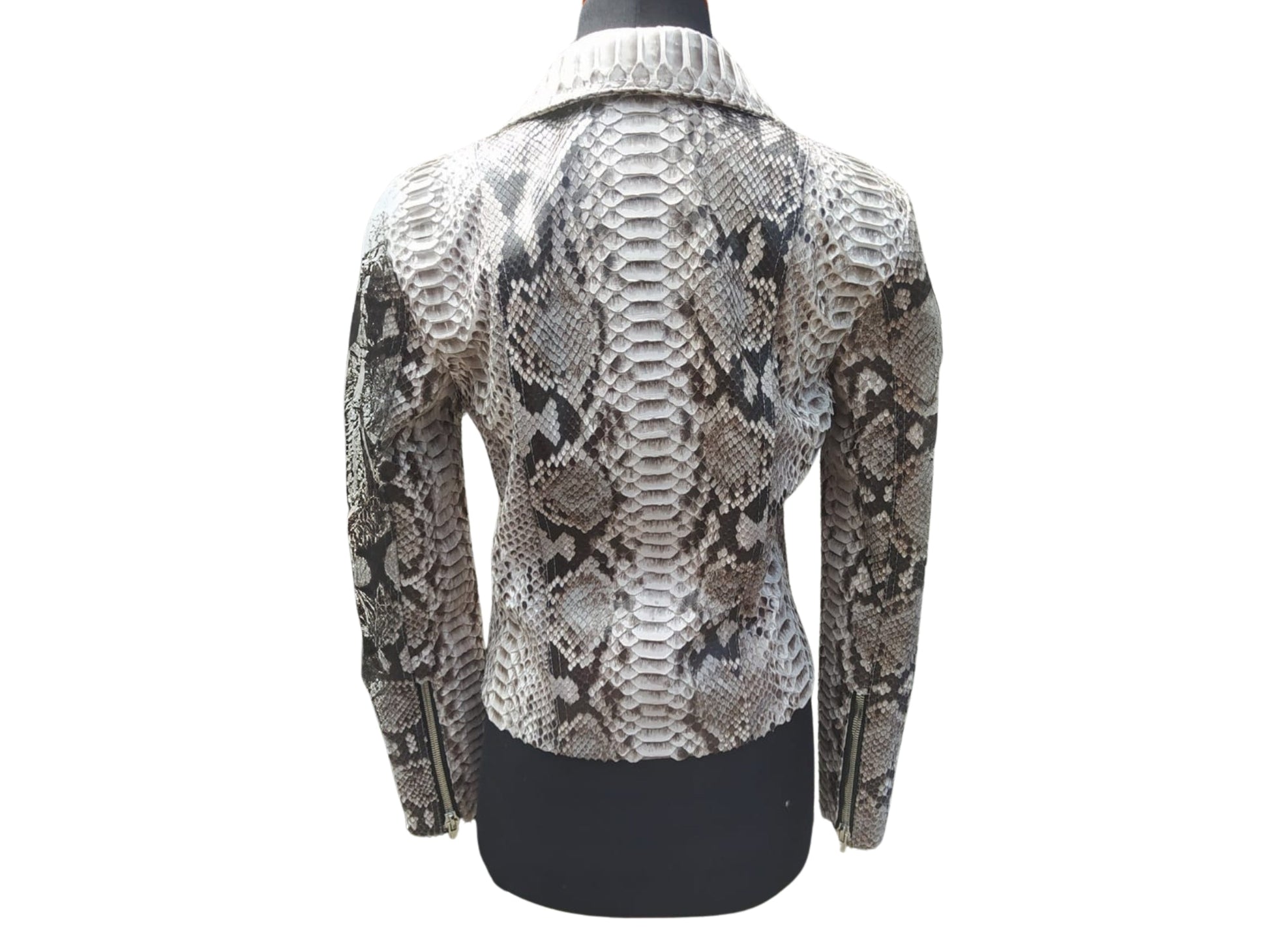 Snakeskin patterned jacket on a mannequin against a white background
