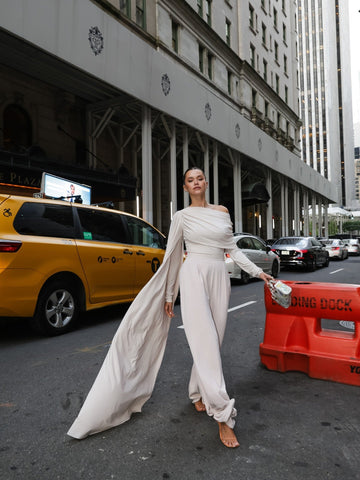 White off-shoulder cape suit