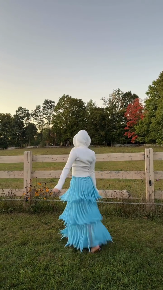 White hooded sweatshirt and light blue layered skirt set