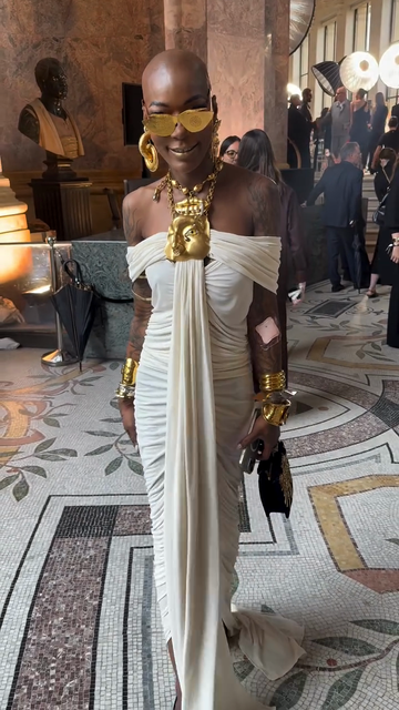 White off-the-shoulder draped gown